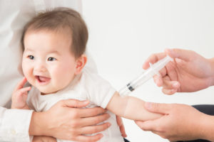 Infant getting an immunization shot