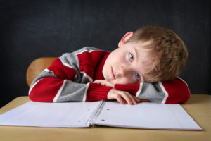 Child struggling with homework due to ADHD