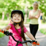 Girl riding bike.